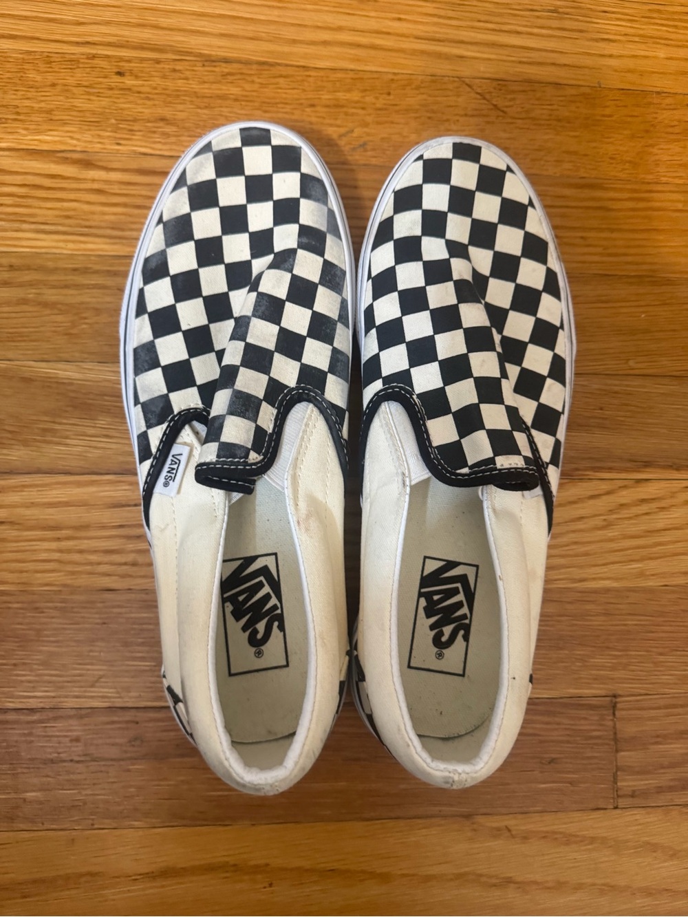 Vans Black and White Checkerboard Slip-On Sneakers